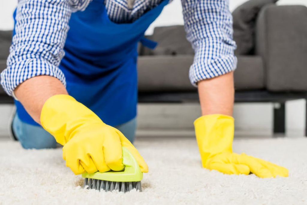 Man cleaning his carpet