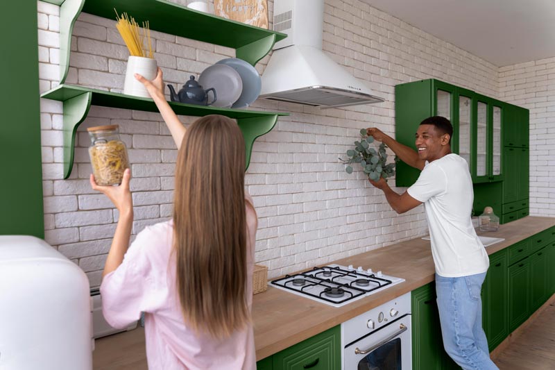 Happy couple on a green kitchen